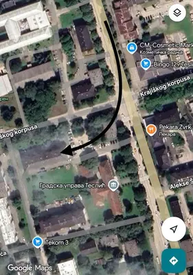 a map of a parking lot with a black circle at Apartman Stanković in Teslić