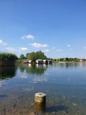 a pole in the middle of a body of water at Apartman Lavanda in Živinice
