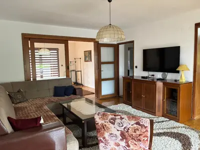 a living room with a couch and a flat screen tv at Apartman Kahvica in Travnik