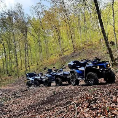 two atvs and two atvs parked on a dirt road at Atrijland Cazin in Cazin