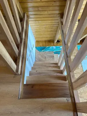 a staircase in a house with wooden ceilings at Atrijland Cazin in Cazin