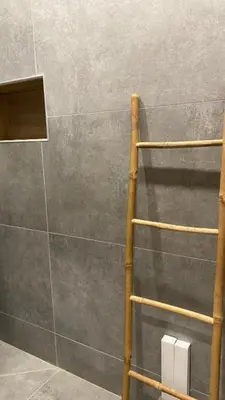 a shower with a wooden ladder in a bathroom at Royal Luxury Apartment in Bihać