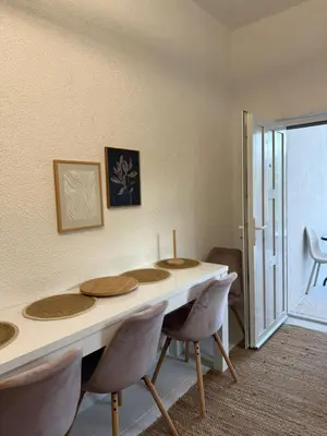 a dining room with a table and chairs at Royal Luxury Apartment in Bihać