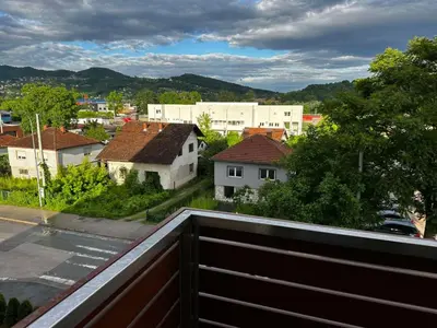 a view of a city from a balcony at Dana'S in Doboj