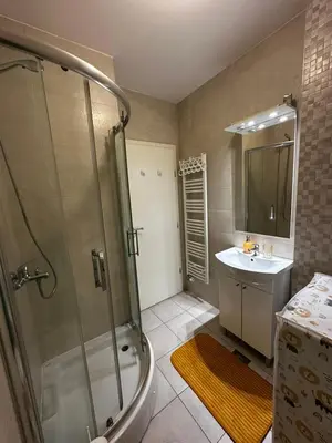 a bathroom with a shower and a sink at Dana'S in Doboj
