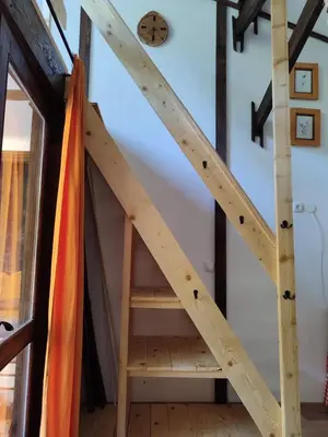 a wooden stairs in a room with a shelf at Plivski raj in Jezero