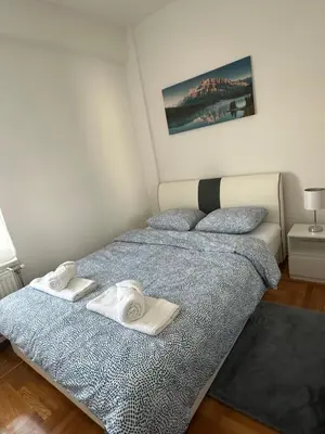 a bedroom with two beds with towels on them at Apartman Radmanović in Banja Luka