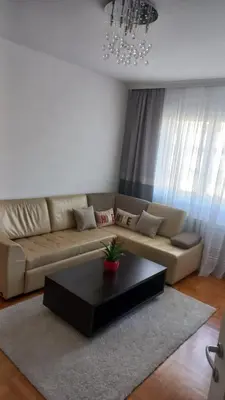 a living room with a couch and a coffee table at Venecija Most in Banja Luka