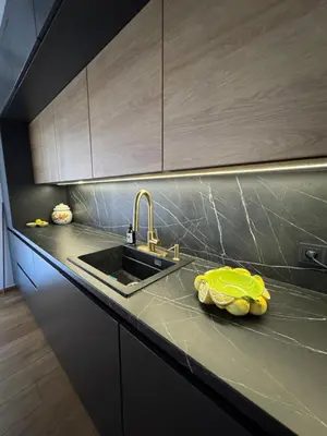 a kitchen with a sink and a yellow bowl on the counter at Una-Luxury-suite in Bihać