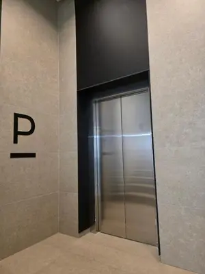a elevator in a building with a sign on the wall at Apartman RS Palata in Banja Luka