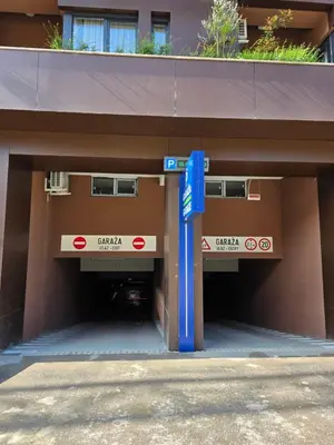 a parking garage with two entrances to a building at Apartman RS Palata in Banja Luka