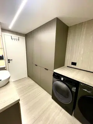 a laundry room with a washing machine in it at Villa Evora in Banja Luka