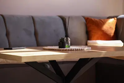 a coffee table with a vase on top of it at Villa Tajna in Brčko