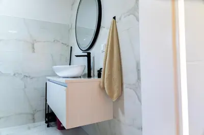 a bathroom with a sink and a mirror at Villa Tajna in Brčko