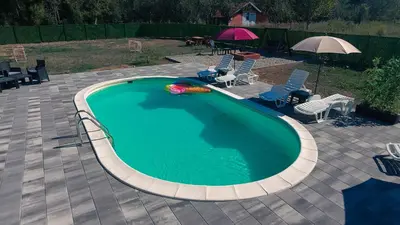 a swimming pool with a toy in the middle at Villa Tajna in Brčko
