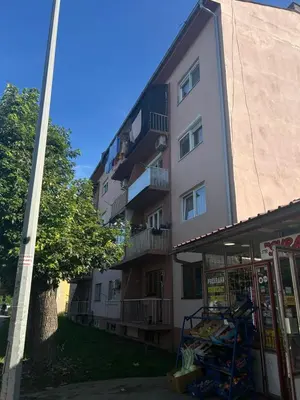 an apartment building with people on the balconies of it at Apartman Iris in Bosanski Brod
