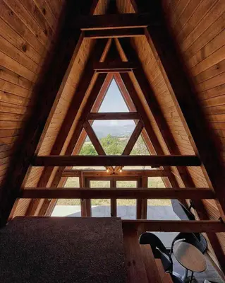 a room with a window in a wooden cabin at Naša Maša Doboj- bungalov Nasa Masa Doboj-bungalov in Doboj