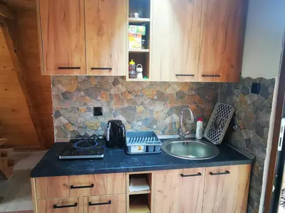 a kitchen with a sink and a counter top at Naša Maša Doboj- bungalov Nasa Masa Doboj-bungalov in Doboj