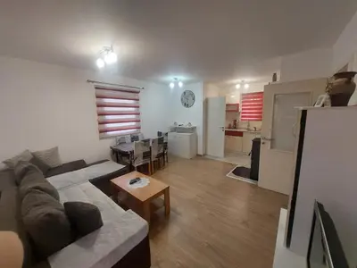 a living room with a couch and a table at Majestic House in Ivišovo Greblje