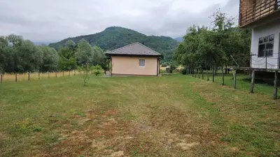 a small house in the middle of a field at Majestic House in Ivišovo Greblje