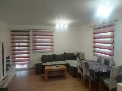 a living room with a couch and a table at Majestic House in Ivišovo Greblje