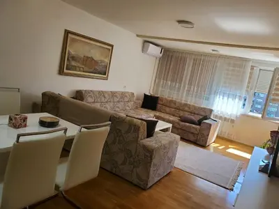 a living room with a couch and a table at StaraCarsija- Zenica, City Center in Zenica