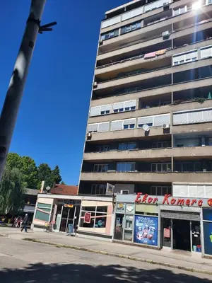 a tall building on a street in front of a building at StaraCarsija- Zenica, City Center in Zenica