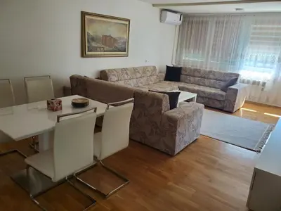 a living room with a couch and a table at StaraCarsija- Zenica, City Center in Zenica