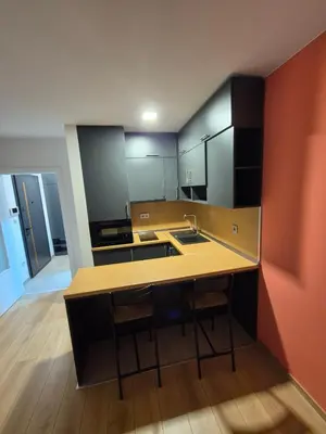 a kitchen with a sink and a counter top at Apartman Belvedere Lux, Doboj in Doboj