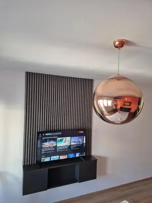 a room with a television and a pendant light at Apartman Belvedere Lux, Doboj in Doboj