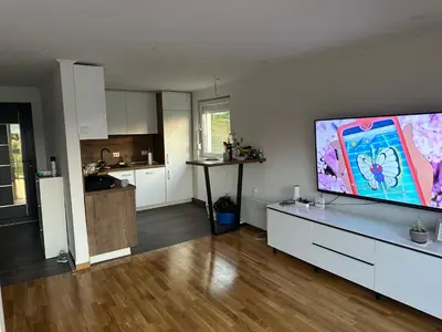 a living room with a large flat screen tv at Apartments Daisy in Banja Luka