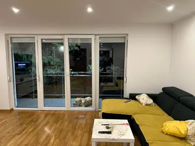 a living room with a couch and a table at Apartments Daisy in Banja Luka
