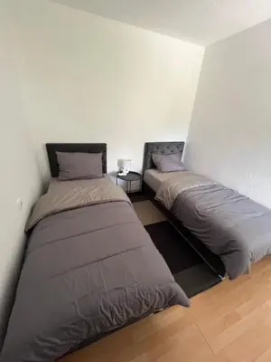 two beds in a room next to each other at Apartment Amila in Jajce