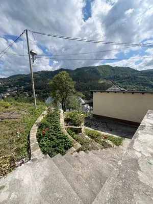 a set of stairs with a view of a mountain at Apartment Amila in Jajce