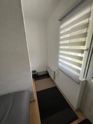 a small room with a window with a window blind at Apartment Amila in Jajce
