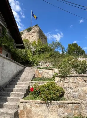 a set of stairs with a flag on a hill at Apartment Amila in Jajce
