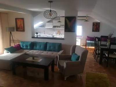 a living room with a couch and chairs and a table at Apartment Nedic in Doboj