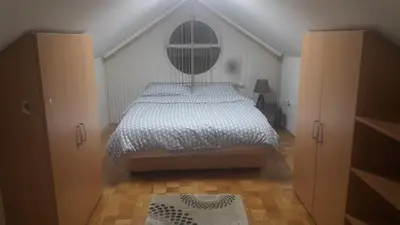 a bedroom with a bed and a window in it at Apartment Nedic in Doboj