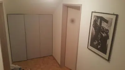 a room with a picture of a painting on the wall at Apartment Nedic in Doboj