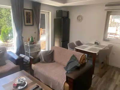 a living room with a couch and a table at Vila Beganovic in Šišava