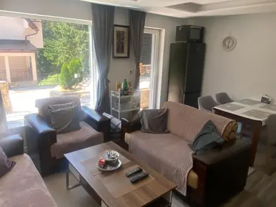 a living room with couches and a coffee table at Vila Beganovic in Šišava