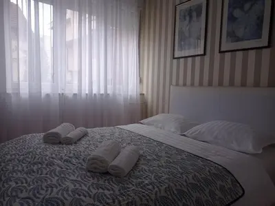 a bedroom with a bed with two towels on it at Apartman Centar in Banja Luka