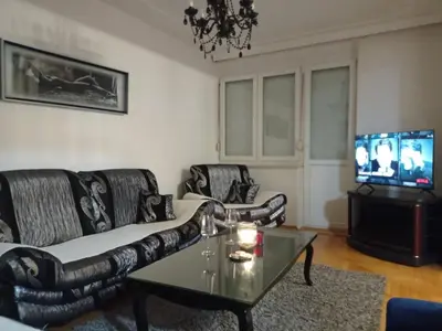 a living room with two couches and a tv at Apartman Centar in Banja Luka