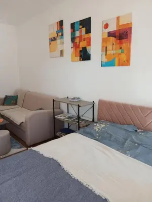 a living room with a bed and a couch at iwe in Banja Luka