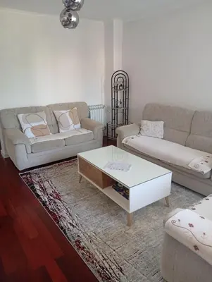 a living room with two couches and a coffee table at Apartman Travnik in Travnik