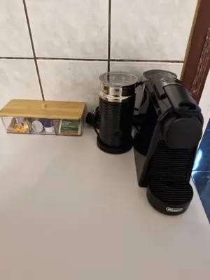 a coffee maker sitting on a counter next to a box at Old Town Maglaj 2, Center ,Parking in Maglaj