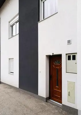 a door on the side of a white building at Old Town Maglaj 2, Center ,Parking in Maglaj
