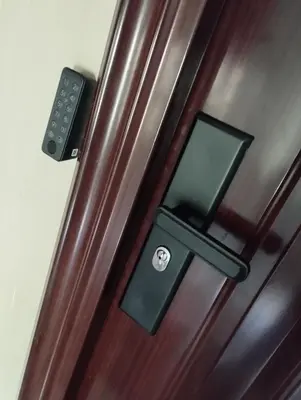 a wooden door with a lock on it at Apartman Leky in Tuzla