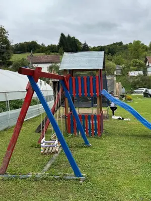 a group of playground equipment in a field at Simetić