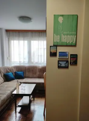 a living room with a couch and a table at Sunny Banja Luka in Banja Luka
